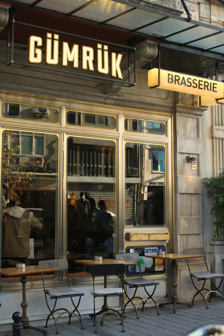 Outdoor café with quaint tables and chairs, framed by classic architecture.